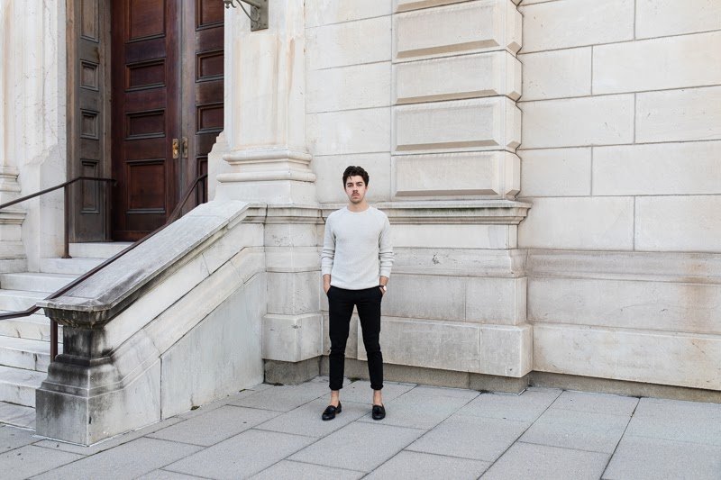 Breland Kiltie Tassel loafer in front of white wall full body