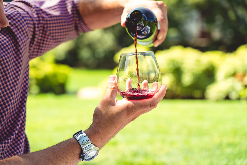 Close up of model pouring wine