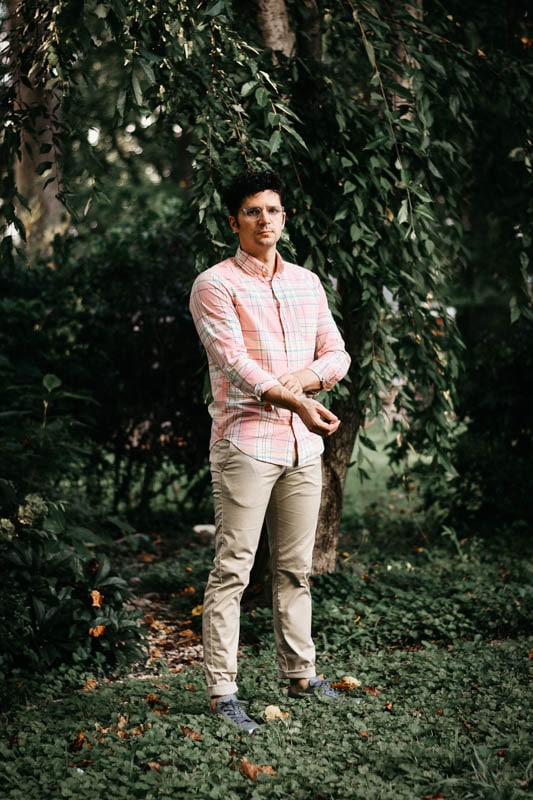 J.Crew model wearing pink madras cotton button up shirt with performance chinos