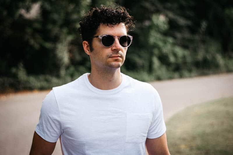 jcrew model wearing sunglasses and white tshirt