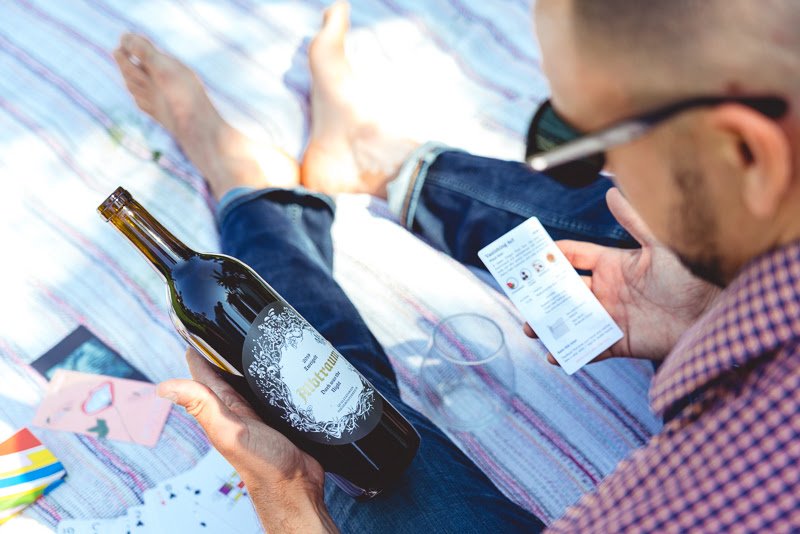 Man learns about wine in park