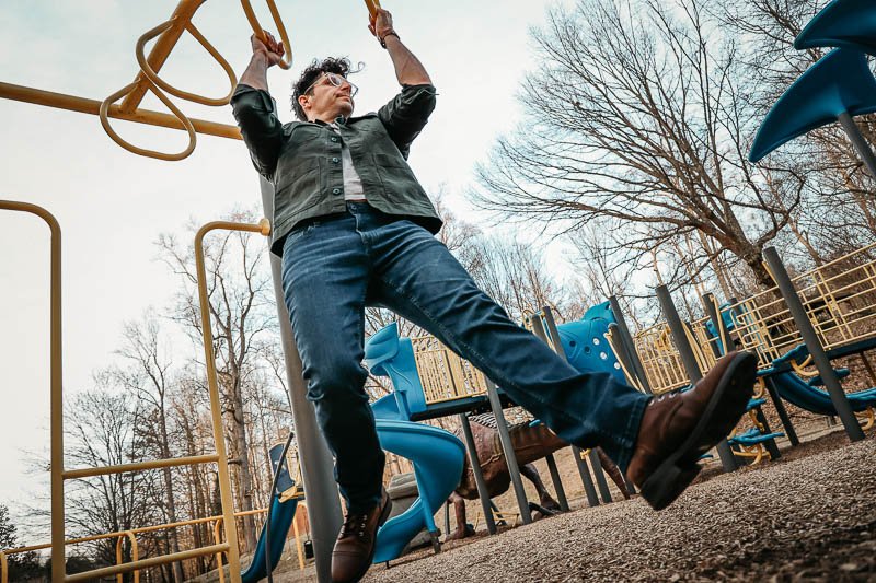 model doing pull ups in The Perfect Jean denim