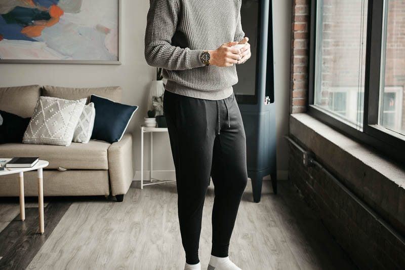 model holding coffee wearing Tommy John relaxed comfort joggers 1