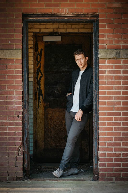 Model standing in brick doorway wearing mgemi fuggire boots