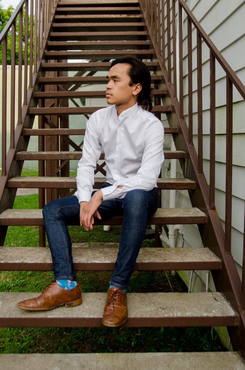 Model Wearing Apposta Coolmax Twill and Sitting On Stairs Wearing Jeans and Boots