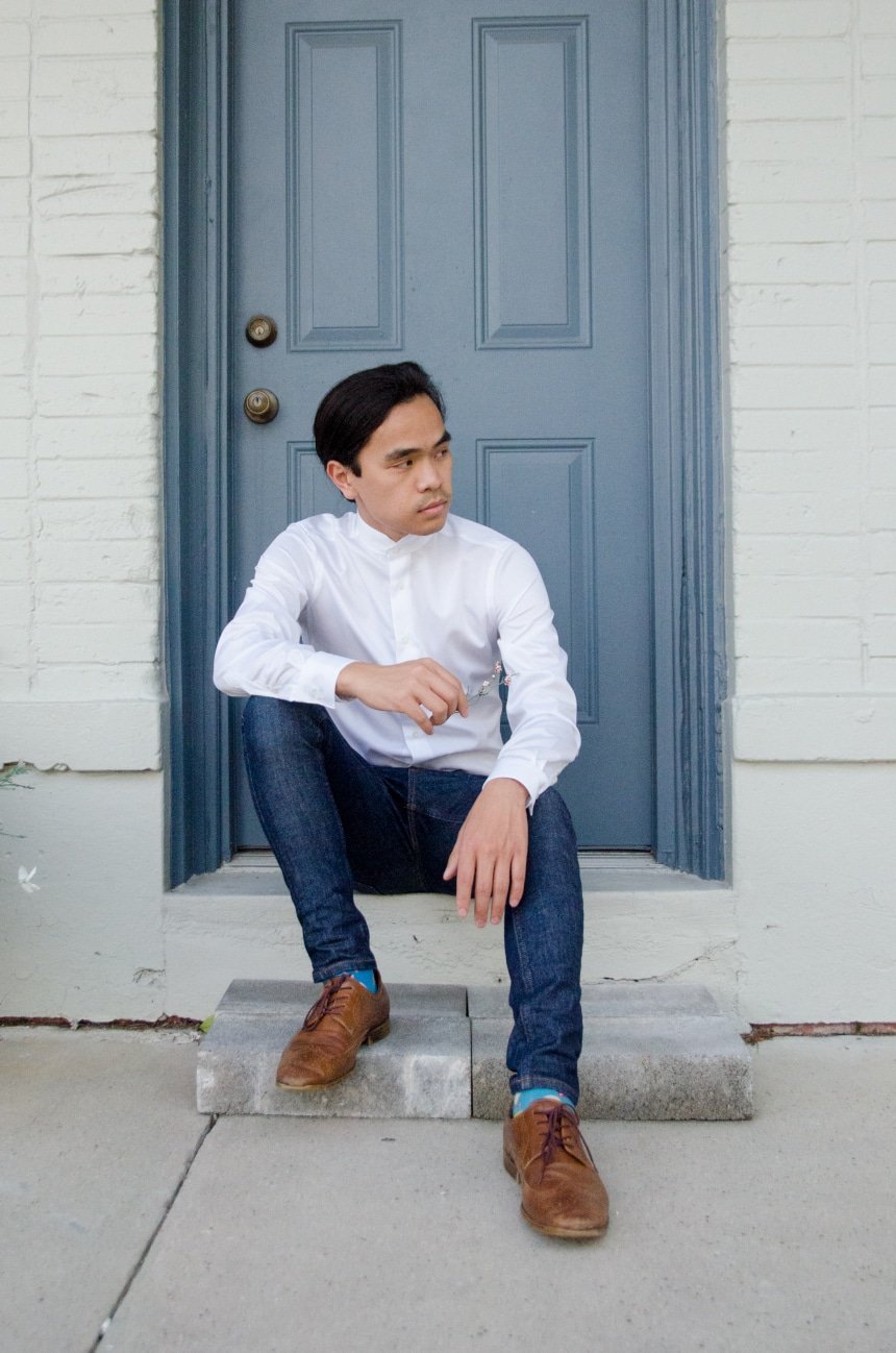 Model Wearing Apposta Coolmax Twill and Sitting On Stoop Wearing Jeans and Boots