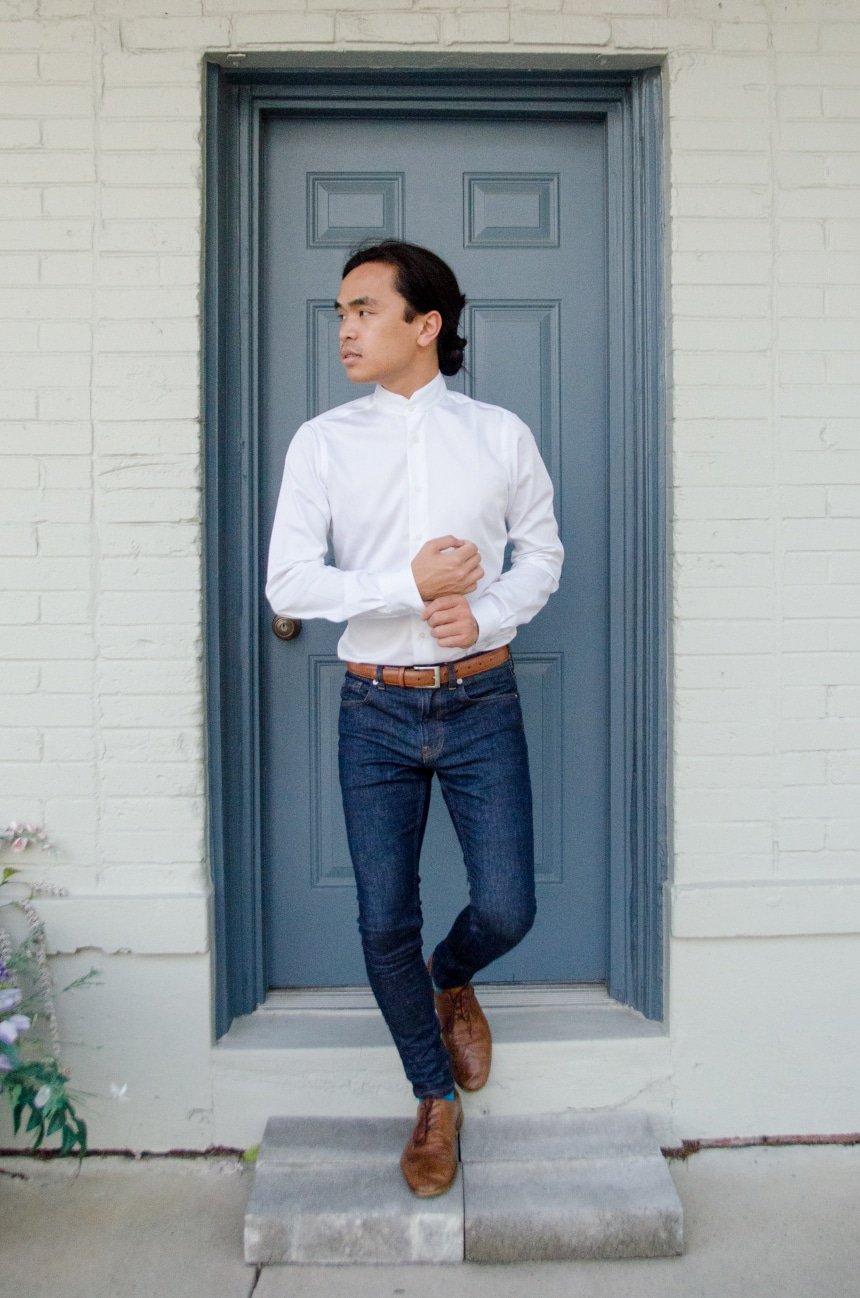 Model Wearing Apposta Coolmax Twill And Standing On Stoop With Shirt Tucked Into Jeans