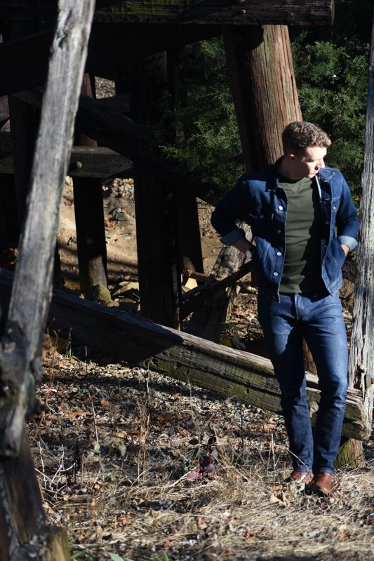 model wearing denim jacket denim pants and everlane terry sweater