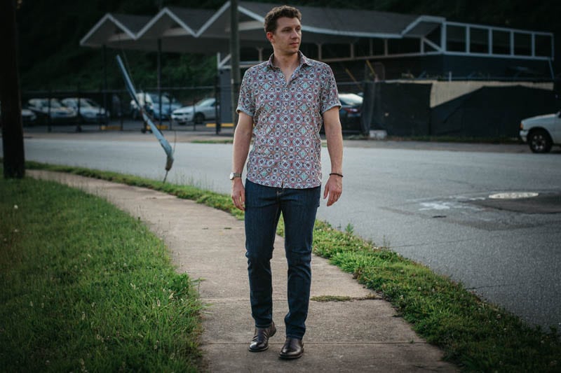 model wearing DUER performance jeans and chelsea boots