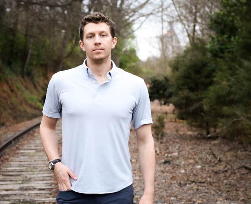 model wearing limitless merino wool polo closeup