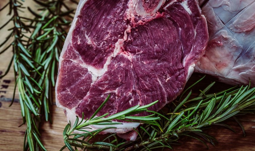 Steak with herbs in background