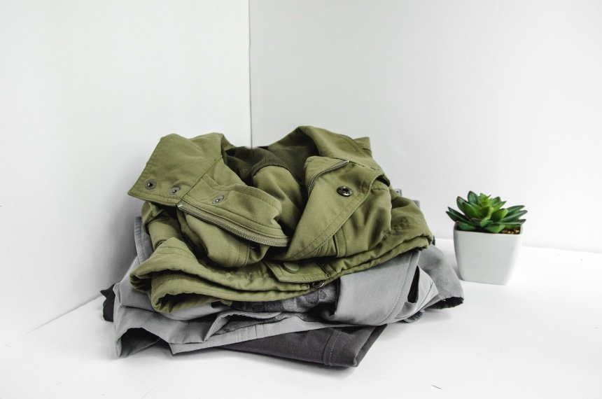 TravelSmith Clothes Piled Up Featuring Voyager Vest, Travel Blazer by Territory Ahead and Flyaway Pants