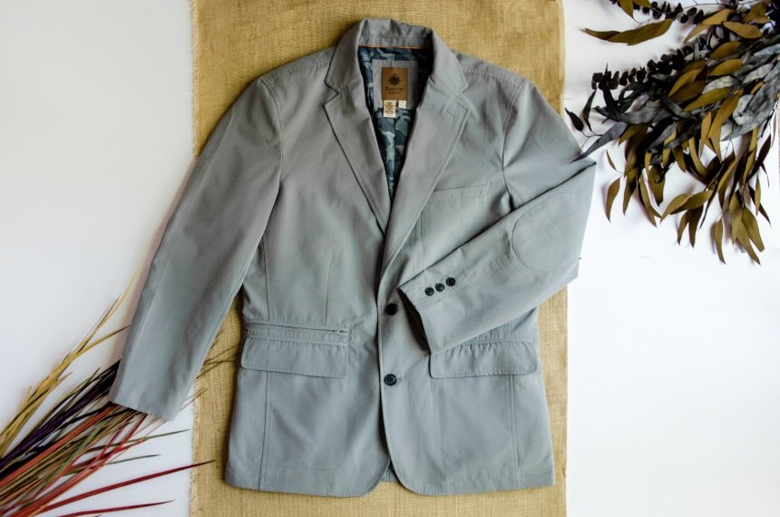 TravelSmith On The Fly Lightweight Year Round Travel Blazer by Territory Ahead in Grey By Itself With Arm Folded on Canvas Background