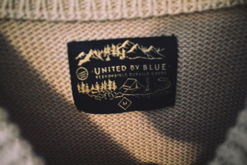 United By Blue Langford Sweater Tan Close Up Tag