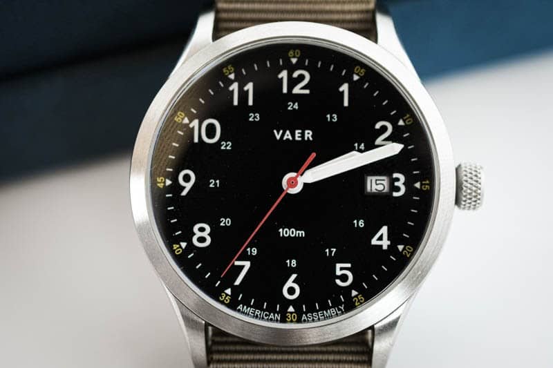 vaer c5 closeup on black dial heritage field watch red second hand detail